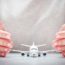 travel insurance hands plane